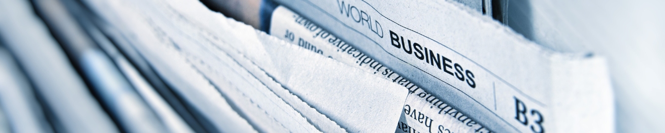 Newspapers Package of newspapers with one stating world business.